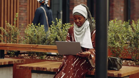 Islamic-Woman-Using-Computer-in-Park